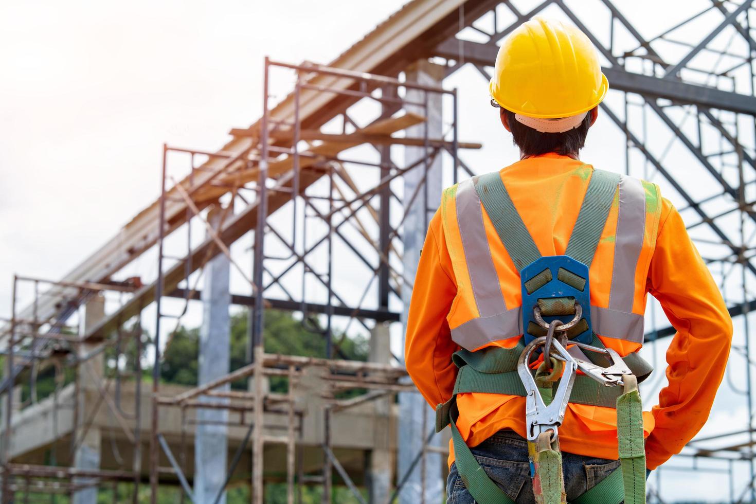 construction-worker-in-front-of-work-site-free-photo